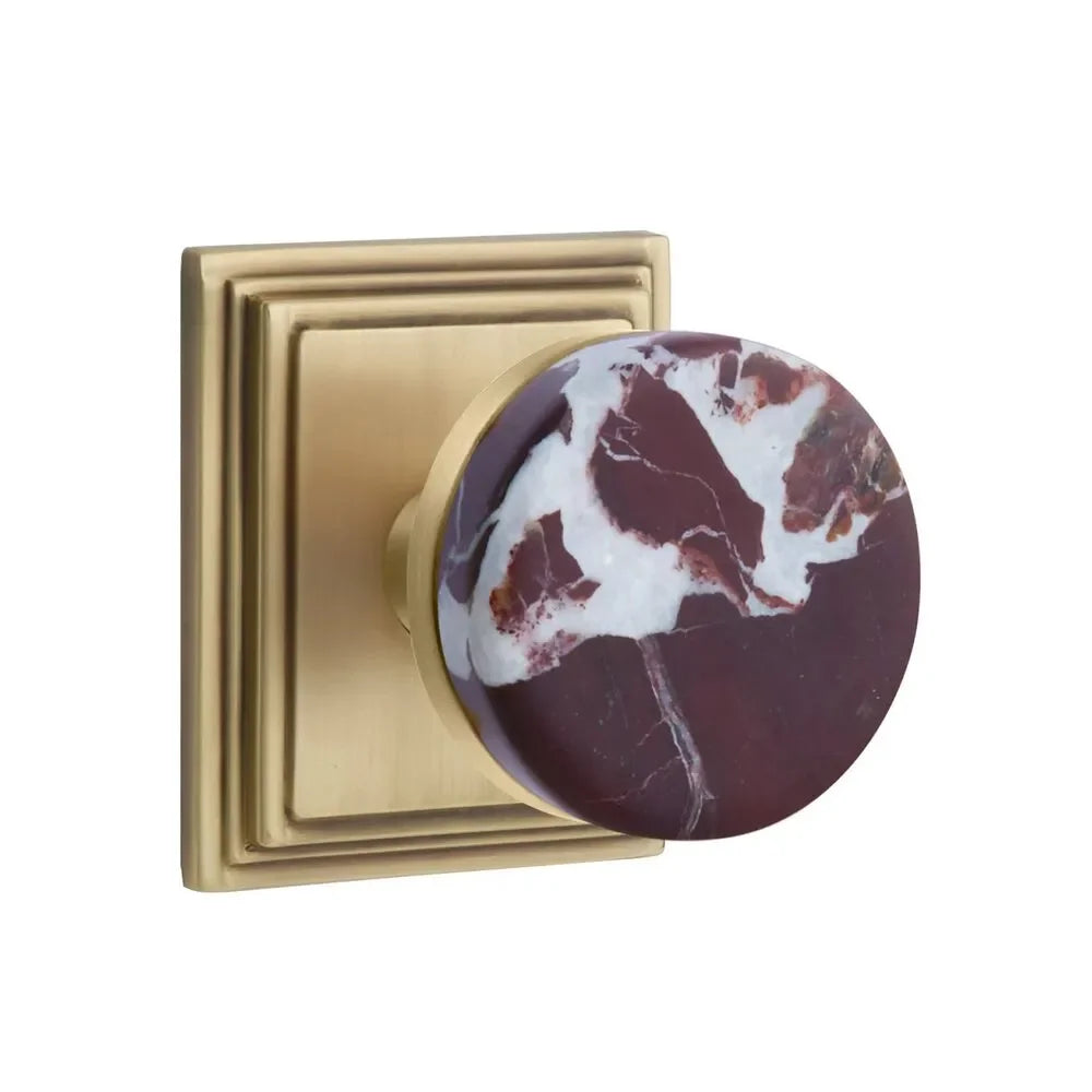 The Emtek Select Conical Rosso Levanto Marble Knobset with Wilshire Rosette in French Antique finish.