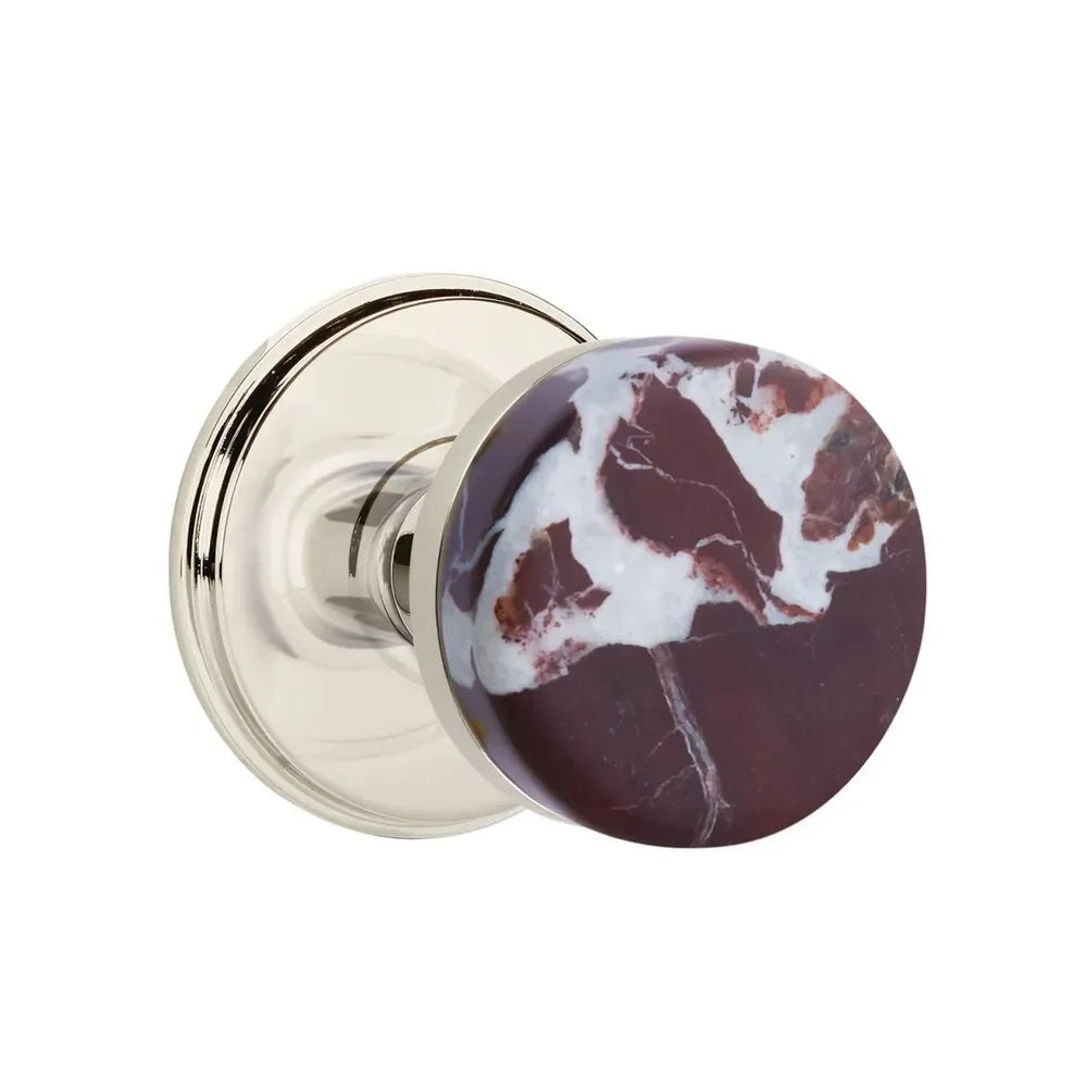The Emtek Select Conical Rosso Levanto Marble Knobset with Watford Rosette in Lifetime Polished Nickel finish.