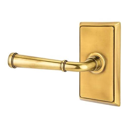The Emtek Merrimack Lever With Rectangular Rosette in French Antique finish