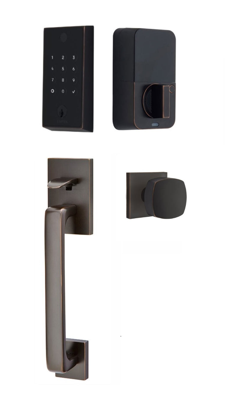 The Emtek EMPowered 2 Touch Entry Set with Baden Grip and Interior Freestone Knob in Oil Rubbed Bronze finish.