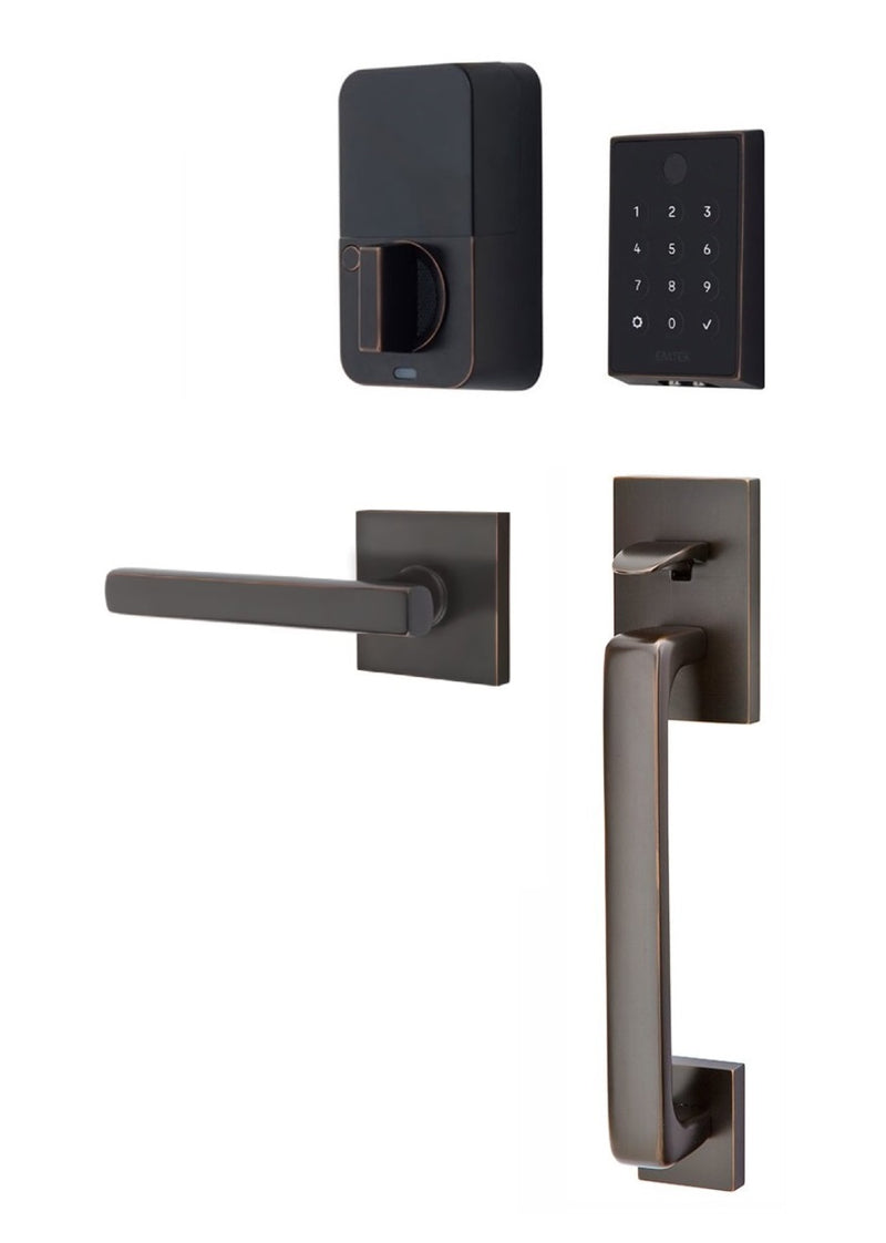 The Emtek EMPowered 2 Touch Entry Set with Baden Grip and Interior Freestone Lever in Oil Rubbed Bronze finish.