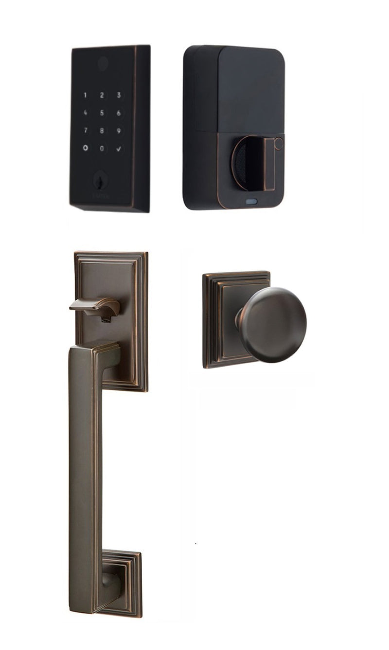 The Emtek EMPowered 2 Touch Entry Set with Hamden Grip and Interior Providence Knob in Oil Rubbed Bronze finish.