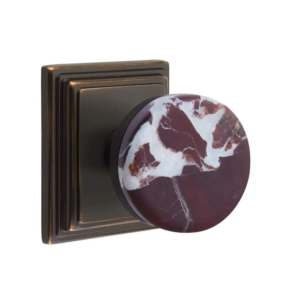 The Emtek Select Conical Rosso Levanto Marble Knobset with Wilshire Rosette in Oil Rubbed Bronze finish.