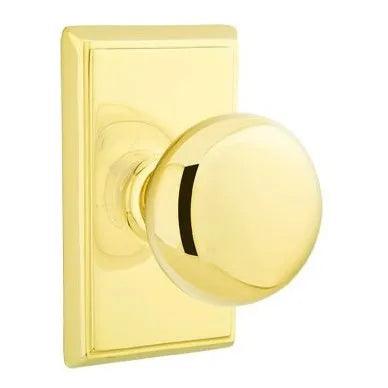 The Emtek Providence Knob with Rectangular Rosette in Lifetime Polished Brass finish.