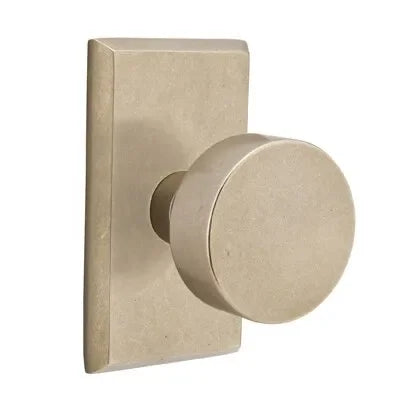 The Emtek Round Bronze Knob with #3 Rosette in Tumbled White Bronze finish