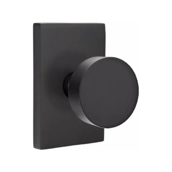 The Emtek Round Knob With Modern Rectangular Rosette in Flat Black finish.