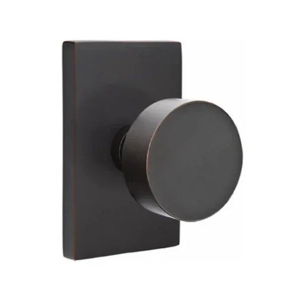 The Emtek Round Knob With Modern Rectangular Rosette in Oil Rubbed Bronze finish.
