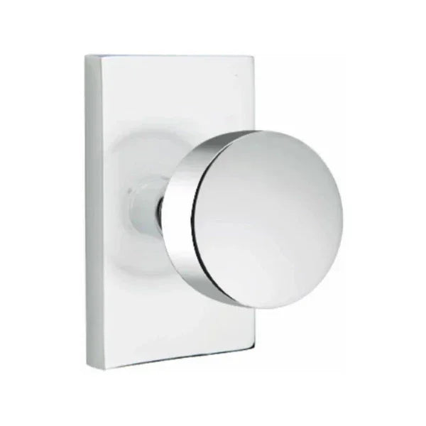 The Emtek Round Knob With Modern Rectangular Rosette in Polished Chrome finish.