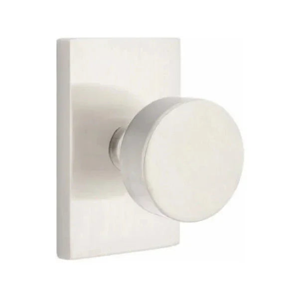 The Emtek Round Knob With Modern Rectangular Rosette in Satin Nickel finish.