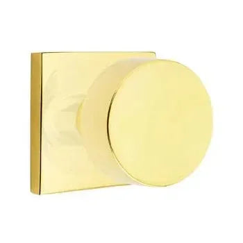 The Emtek Round Knob with Square Rosette in Unlacquered Brass finish.