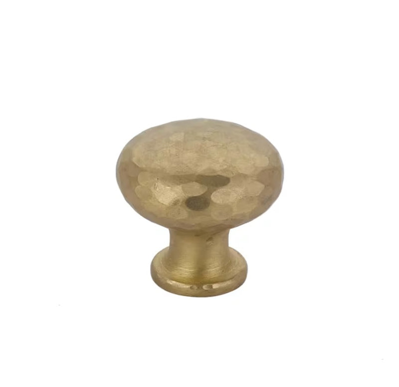 The Emtek Arts & Crafts Round Dimpled Knob in Satin Brass finish.