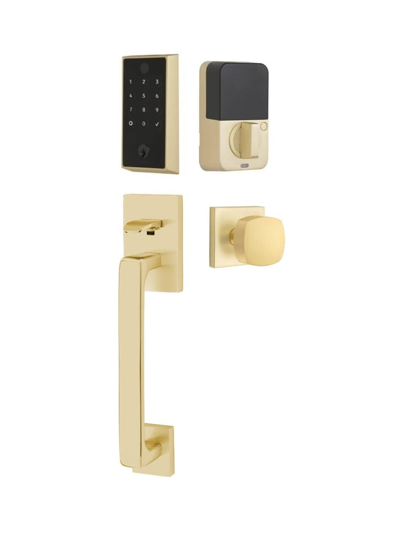 The Emtek EMPowered 2 Touch Entry Set with Baden Grip and Interior Freestone Knob in Satin Brass finish.