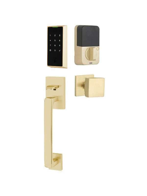 The Emtek EMPowered 2 Touch Entry Set with Baden Grip and Interior Square Knob in Satin Brass finish.