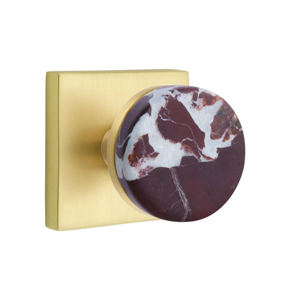 The Emtek Select Conical Rosso Levanto Marble Knobset with Square Rosette in Satin Brass finish.