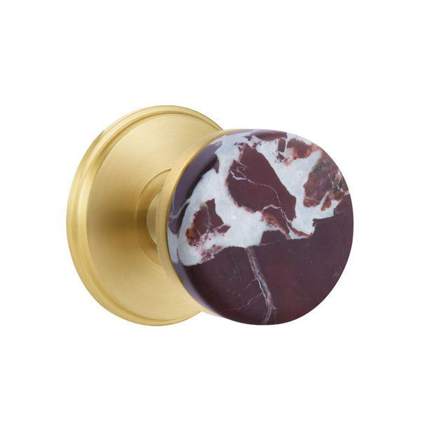 The Emtek Select Conical Rosso Levanto Marble Knobset with Watford Rosette in Satin Brass finish.