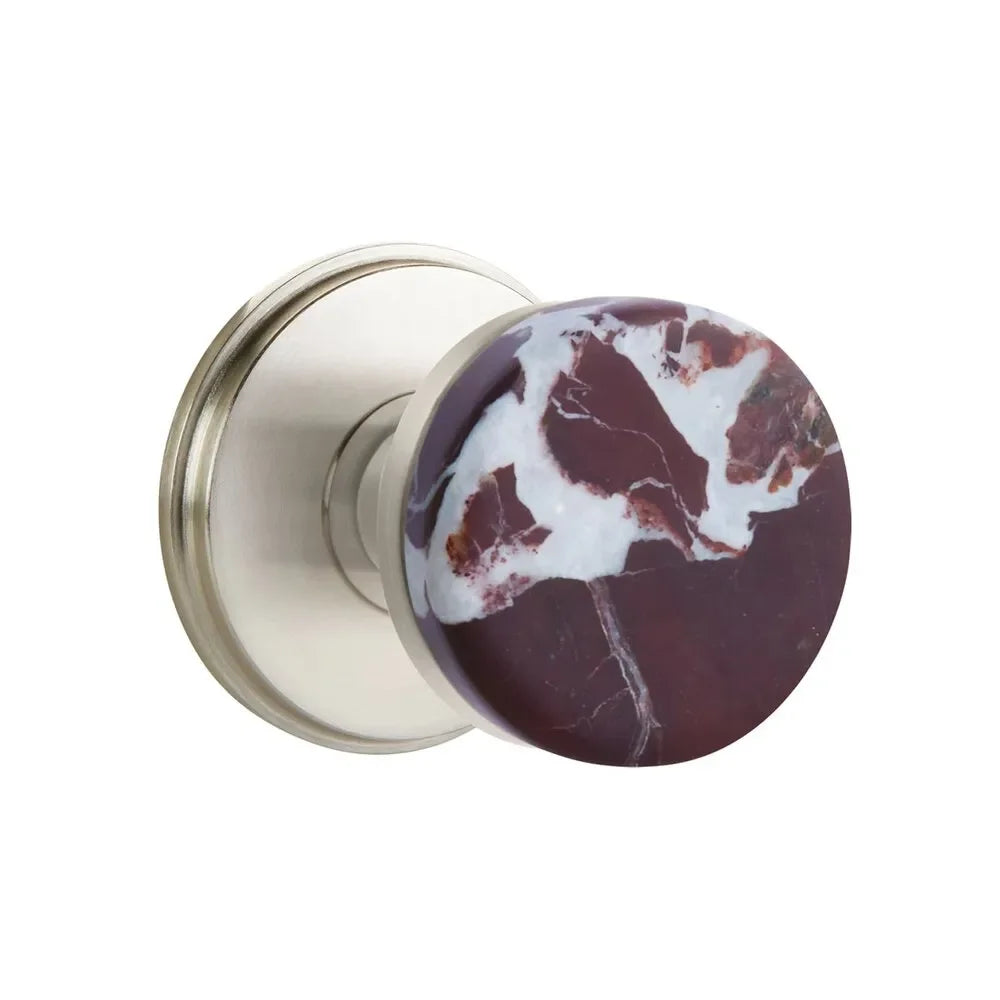 The Emtek Select Conical Rosso Levanto Marble Knobset with Watford Rosette in Satin Nickel finish.
