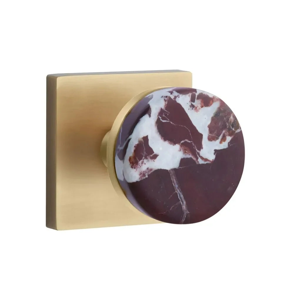 The Emtek Select Conical Rosso Levanto Marble Knobset with Square Rosette in French Antique finish.