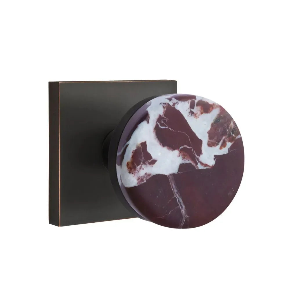 The Emtek Select Conical Rosso Levanto Marble Knobset with Square Rosette in Oil Rubbed Bronze finish.