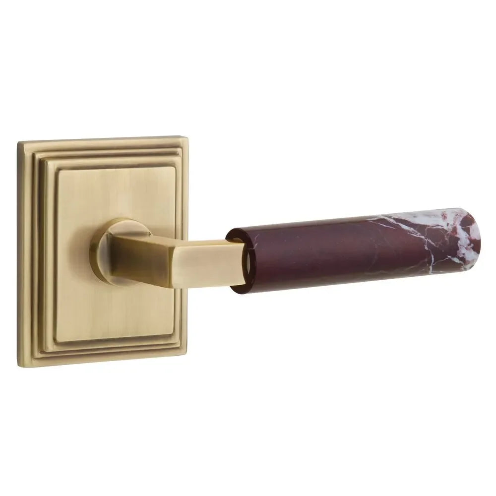 The Emtek Select L-Square Rosso Levanto Marble Lever with Wilshire Rosette in French Antique finish.