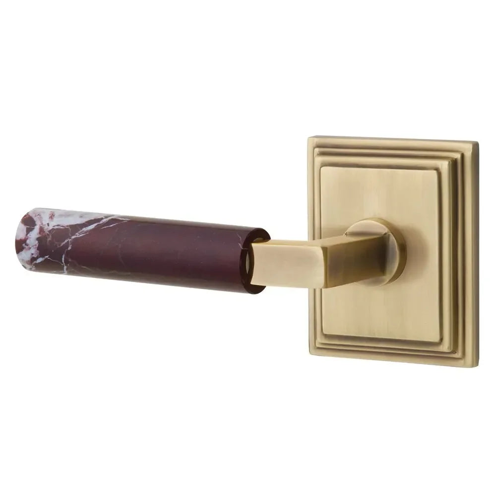 The Emtek Select L-Square Rosso Levanto Marble Lever with Wilshire Rosette in French Antique finish.