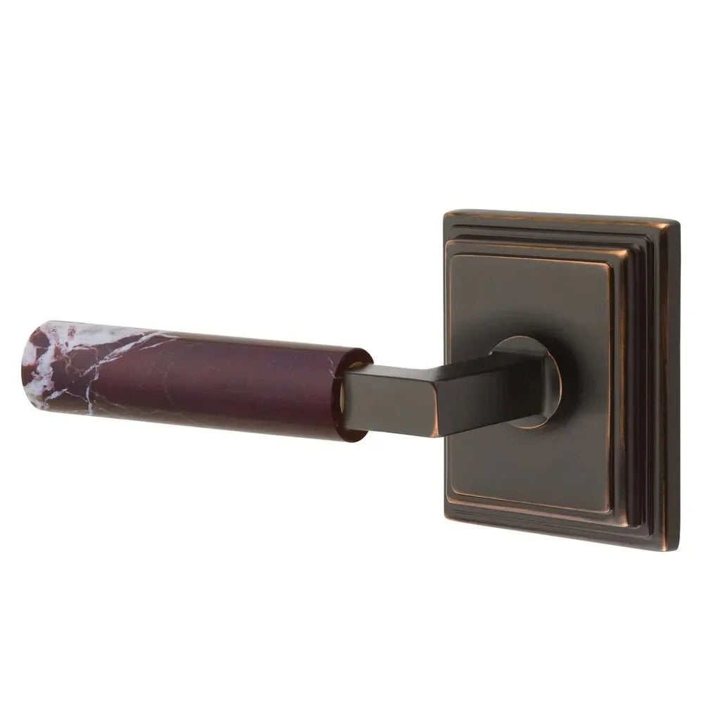 The Emtek Select L-Square Rosso Levanto Marble Lever with Wilshire Rosette in Oil Rubbed Bronze finish.