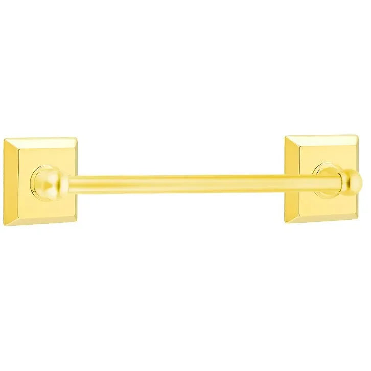 The Emtek Traditional Brass Towel Bar with Quincy Rosette in Lifetime Polished Brass finish.