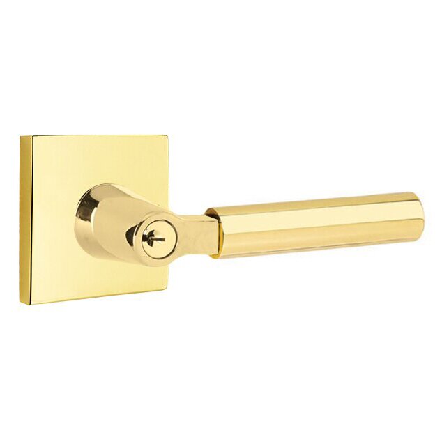 The Emtek Hercules Lever With Square Rosette in Unlacquered Brass finish