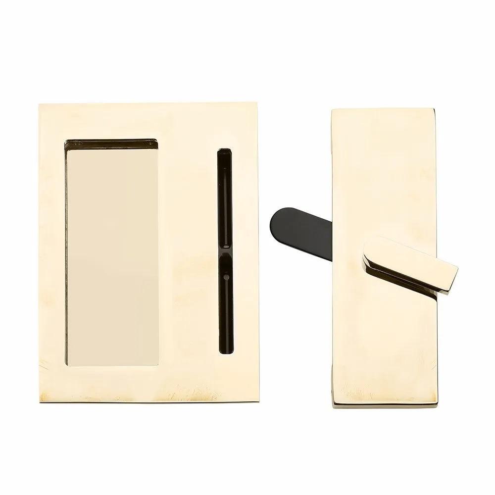 The Emtek Modern Rectangular Barn Door Privacy Lock and Flush Pull with Integrated Strike in Unlacquered Brass finish