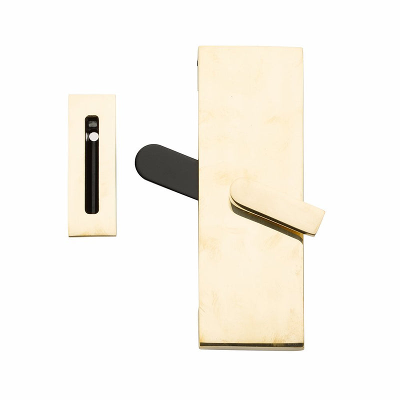 The Emtek Modern Rectangular Barn Door Privacy Lock with Strike in Unlacquered Brass finish