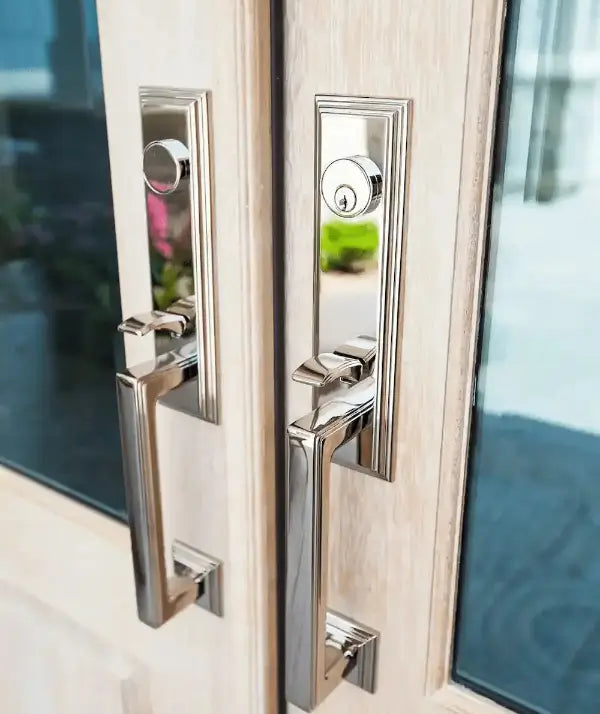 Close-up of a door with metallic handles and glass panels