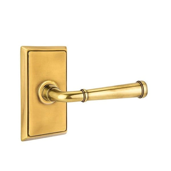 The Emtek Merrimack Lever With Rectangular Rosette in French Antique finish