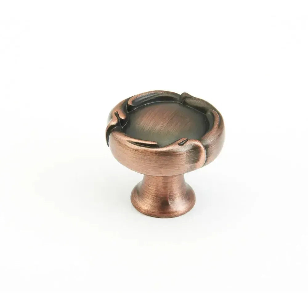 The Schaub French Farm Round Cabinet Knob in Empire Bronze finish.