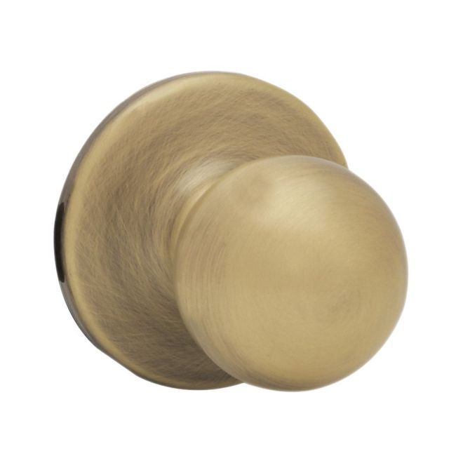 Kwikset Polo Passage Knob in Antique Brass finish