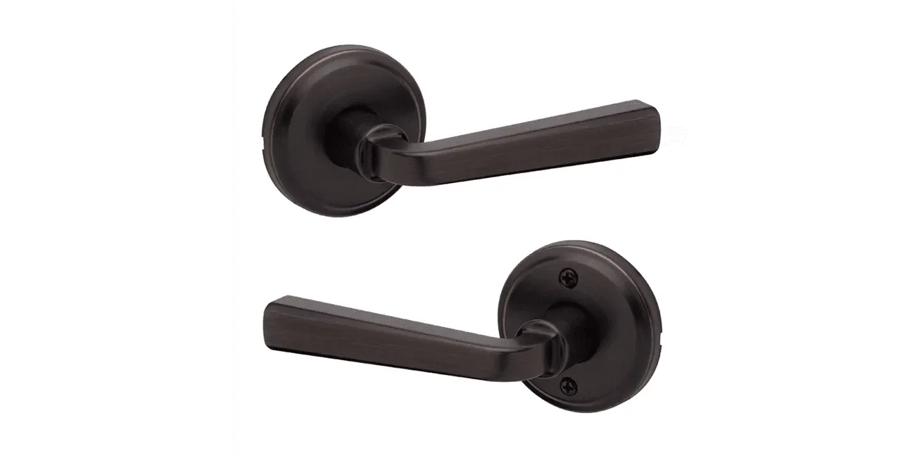Kwikset Trafford Passage Lever in Venetian Bronze finish