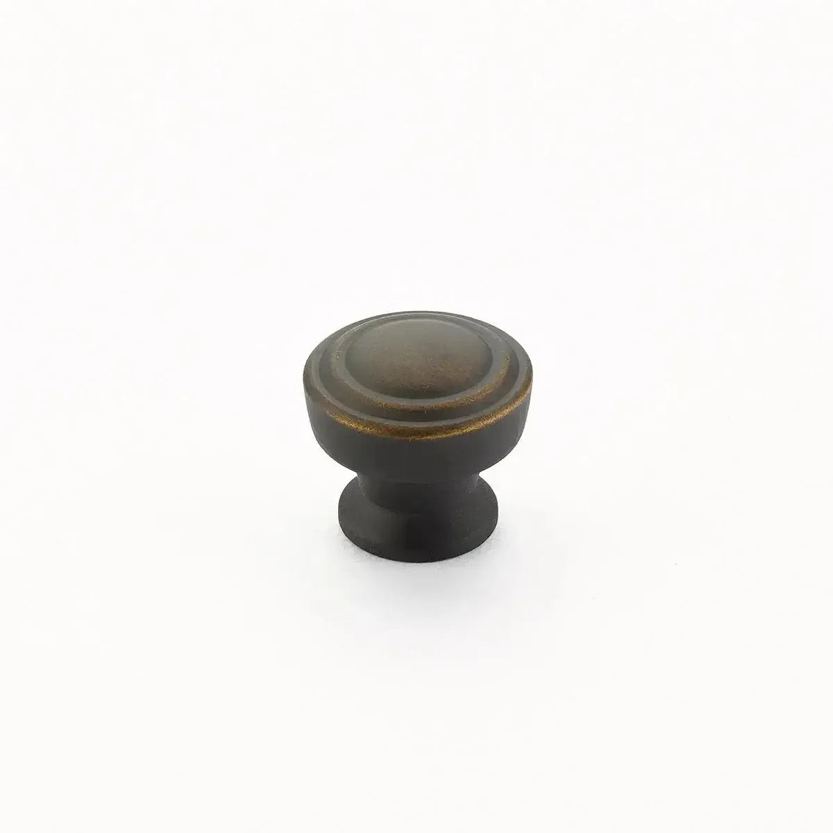 The Schaub Menlo Park Stepped Round Cabinet Knob in Ancient Bronze finish.