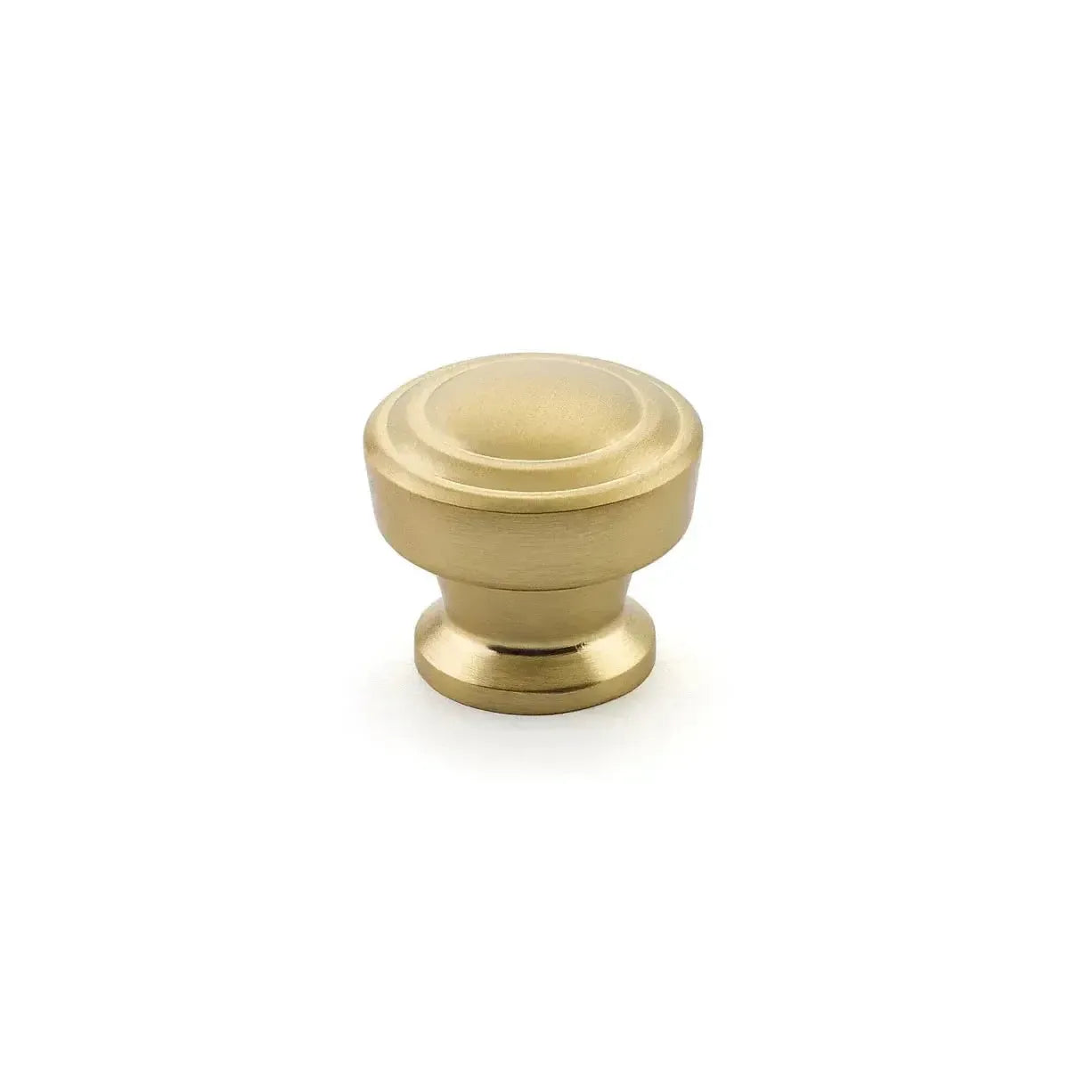 The Schaub Menlo Park Stepped Round Cabinet Knob in Signature Satin Brass finish.