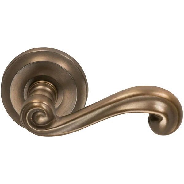 The Omnia Traditions 55 Lever with Round Rosette in Antique Bronze, Unlacquered finish