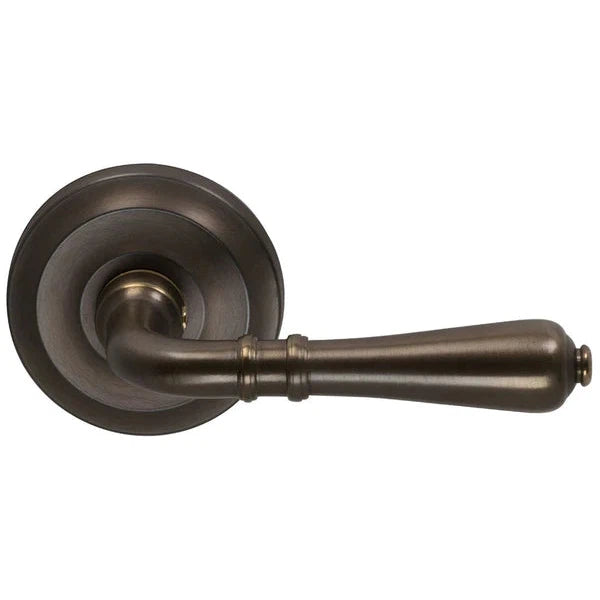 The Omnia Traditions 752 Lever with Round Rosette in Antique Bronze, Unlacquered finish