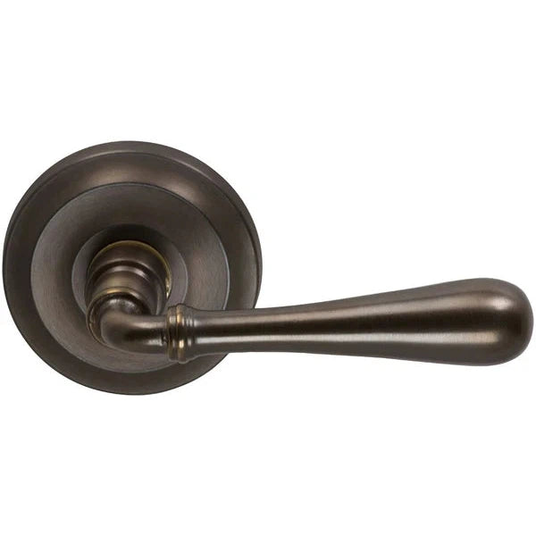 The Omnia Traditions 918 Lever with Round Rosette in Antique Bronze, Unlacquered finish