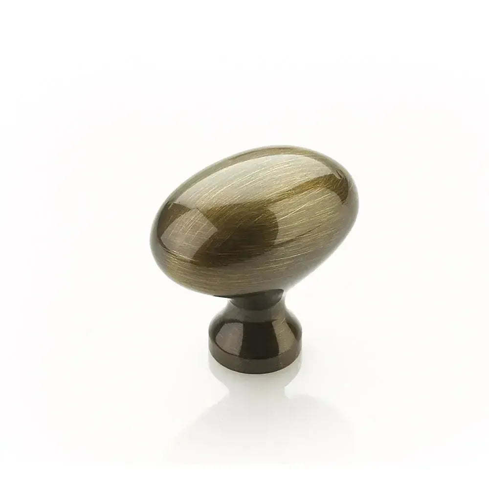 The Schaub Country Oval Cabinet Knob in Antique Brass finish.