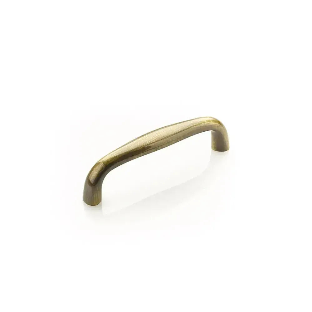 The Schaub Traditional Cabinet Pull in Antique Brass finish.
