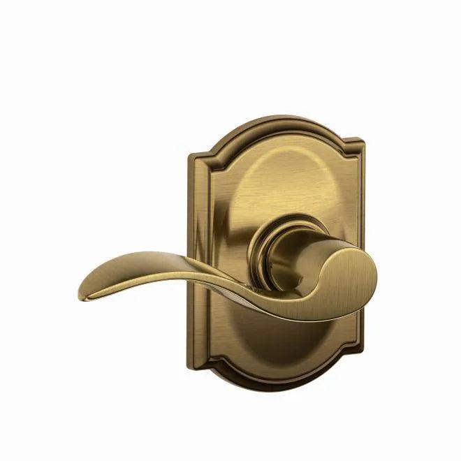 Schlage Accent Passage Lever With Camelot Rosette in Antique Brass finish