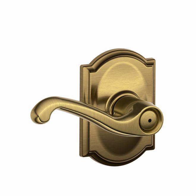 Schlage Flair Privacy Lever With Camelot Rosette in Antique Brass finish