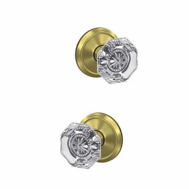 The Schlage Custom Alexandria Passage and Privacy Glass Knob With Alden Rosette in Satin Brass finish