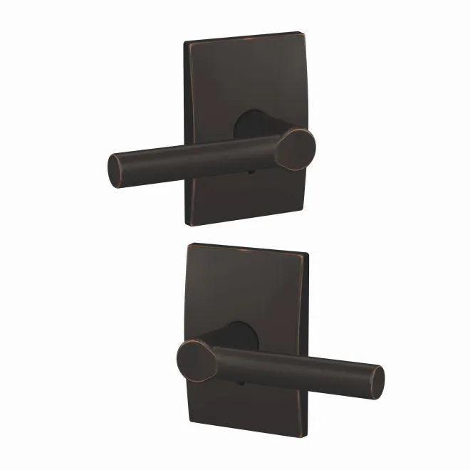 The Schlage Custom Broadway Lever With Century Rosette Non Turning Double Dummy Pair in Aged Bronze finish