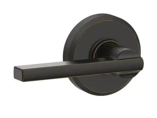 Schlage Latitude Passage Lever With Greyson Rosette in Aged Bronze finish