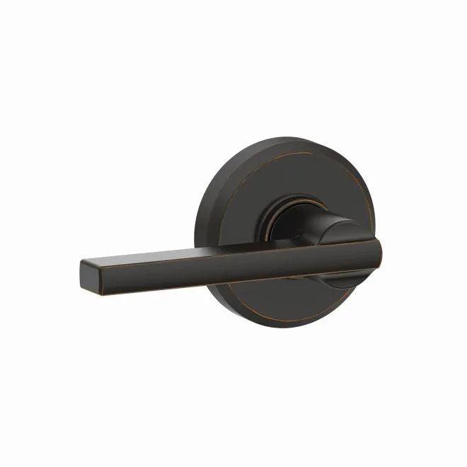 The Schlage Latitude Passage Lever With Greyson Rosette in Aged Bronze finish