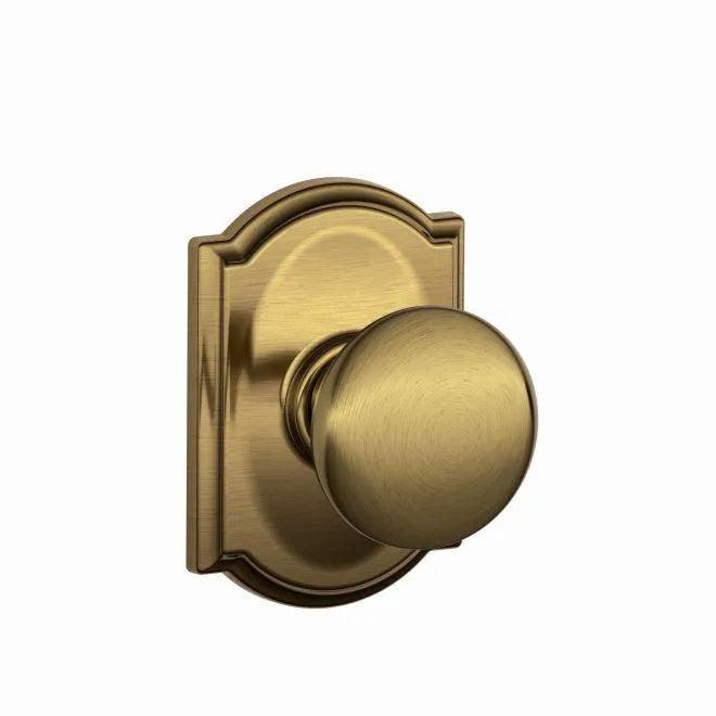 Schlage Plymouth Passage Knob With Camelot Rosette Antique Brass