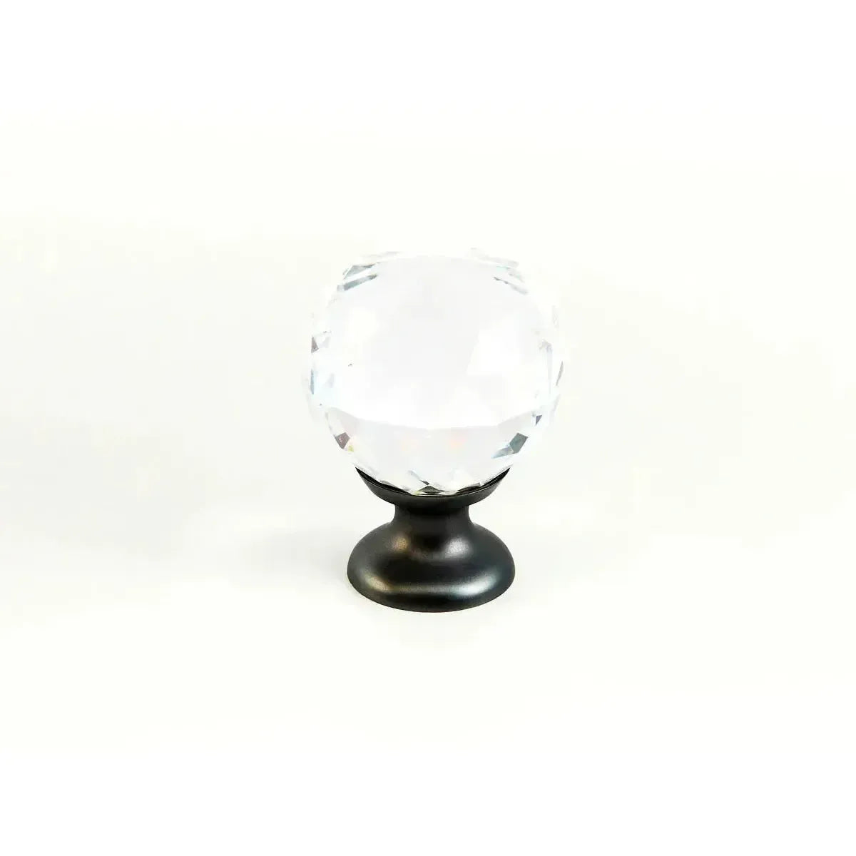 The Schaub Stargaze Round Glass Cabinet Knob in Bronze finish.