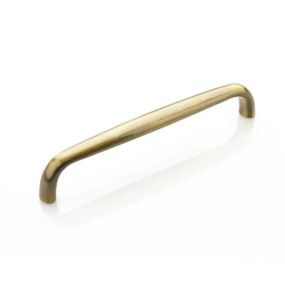 The Schaub Traditional Cabinet Pull in Antique Brass finish.